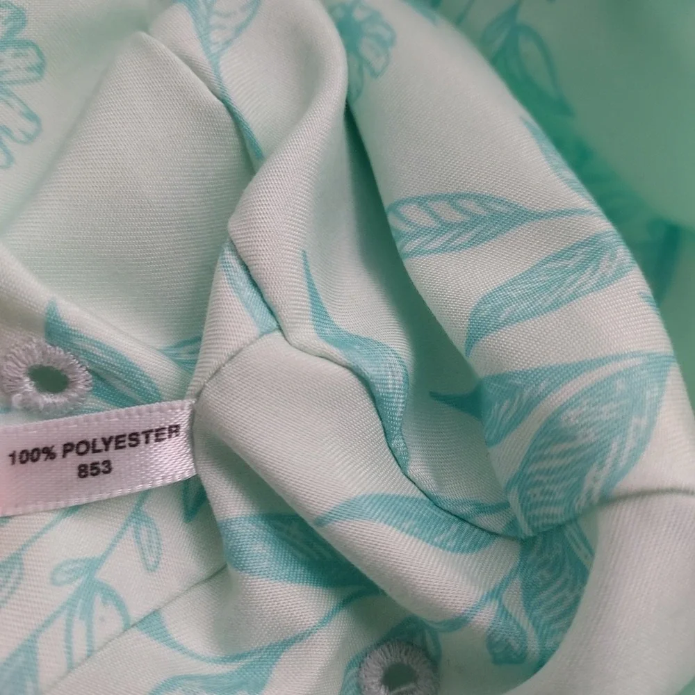 Women's Eddie Bauer floral bucket hat in mint green with aqua blue leaf floral